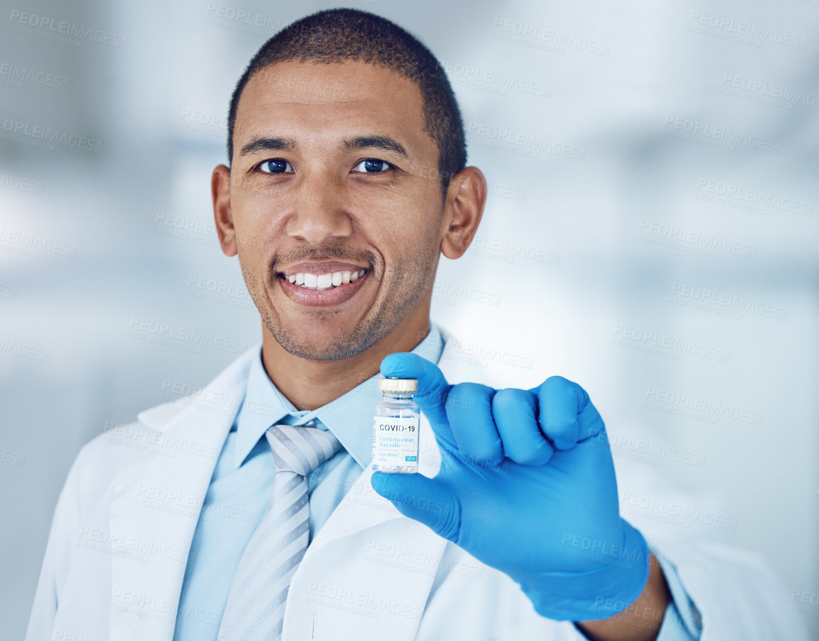 Buy stock photo Portrait of man, doctor and vaccine bottle in hand for covid in hospital, safety and pharmaceutical drugs. Healthcare, medicine and medical professional with sample for corona vaccination in clinic.