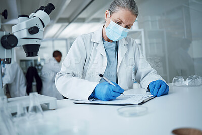 Buy stock photo Senior woman, science and lab writing for research and notes for medical analysis. Scientist, investigation and laboratory documents for doctor and healthcare report with paperwork and data planning