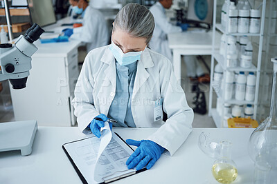 Buy stock photo Senior woman, scientist and lab writing for research and notes for medical analysis. Info, investigation and laboratory documents for covid and healthcare report with paperwork and data planning