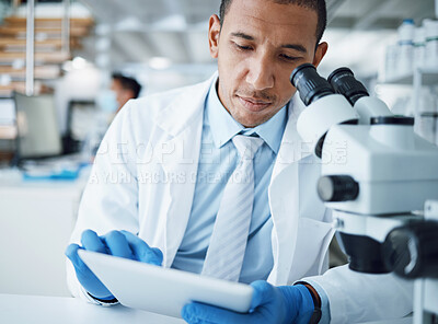 Buy stock photo Microscope, science and man with tablet in laboratory for research, medical analysis and biotechnology. Scientist, microbiology and investigation with digital technology, dna testing and development