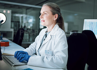 Buy stock photo Woman, night and keyboard in science laboratory for medical research, deadline and pharmacy wellness. Mature scientist, person and working late on technology for DNA healthcare or genetic engineering