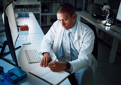Buy stock photo Doctor, writing notes and night in laboratory for medical research and study for healthcare report. Paperwork, African male professional and planning with data for biotechnology in clinic or hospital