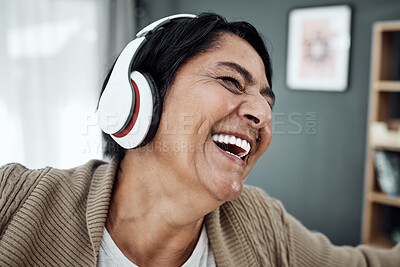 Buy stock photo Headphones, face or happy woman streaming music or dancing to relax with freedom at home. Retirement, smile or excited senior person laughing or listening to a radio song or audio on subscription 