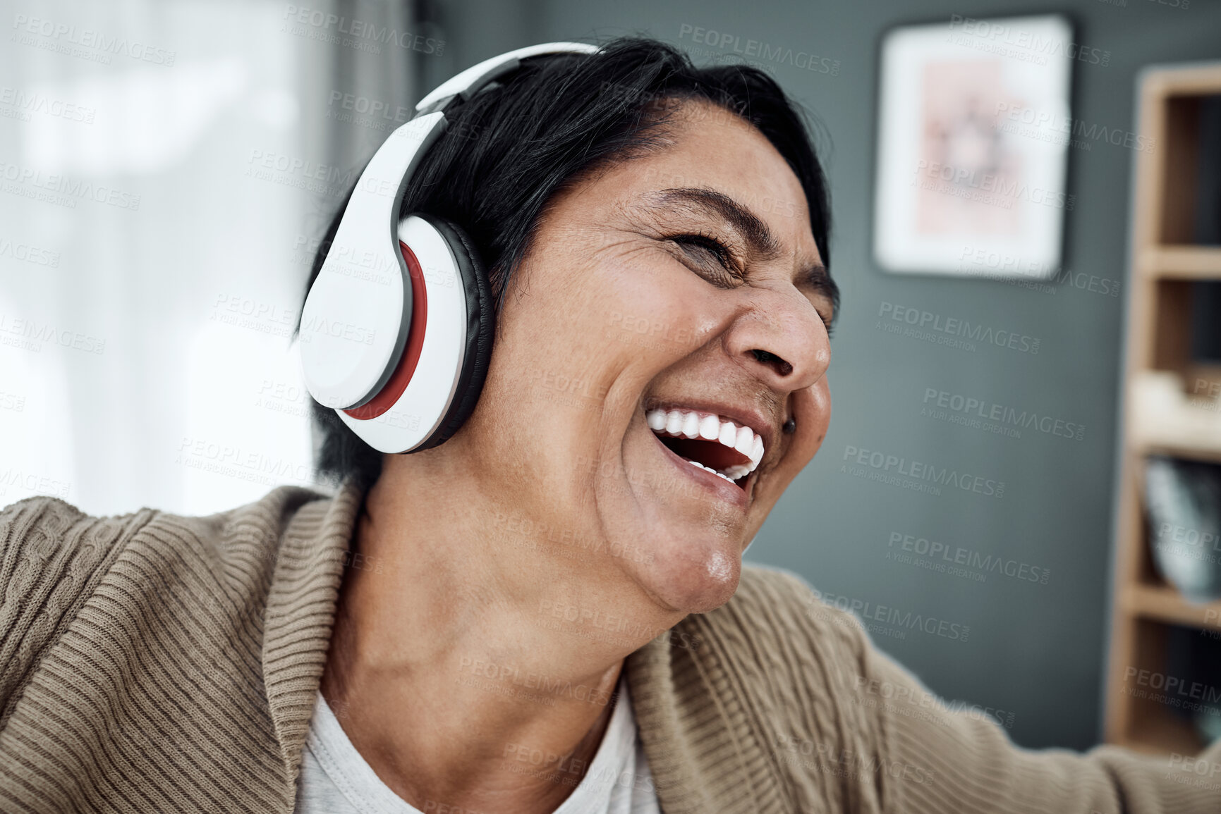 Buy stock photo Headphones, face or happy woman streaming music or dancing to relax with freedom at home. Retirement, smile or excited senior person laughing or listening to a radio song or audio on subscription 