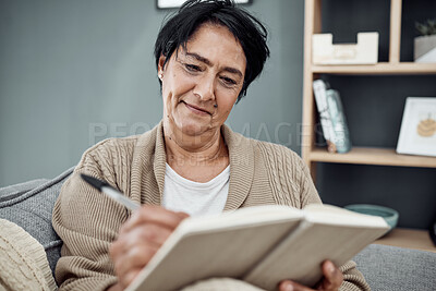 Buy stock photo Smile, relax and an old woman writing in her journal while sitting in the living room of her retirement home. Notebook, pen and a happy senior female pensioner on a sofa, taking notes in a diary