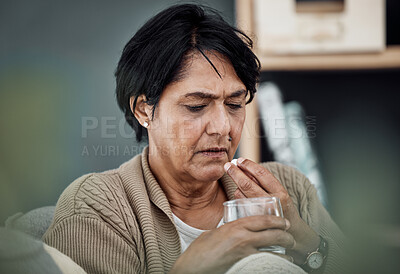 Buy stock photo Depression, drinking water or old woman in home to take pills, vitamins or supplements as medicine. Medical, sick or lonely senior person taking drugs or medication tablets for fatigue or anxiety 