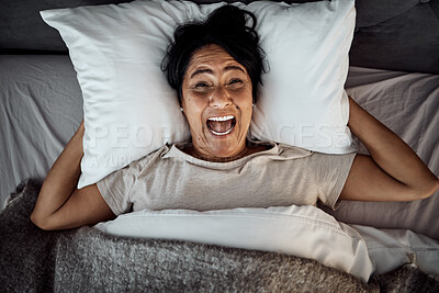 Buy stock photo Screaming, above and a woman in bed with mental health, stress or bipolar. Sad, anxiety and an awake senior person with portrait, insomnia and anger in the bedroom in the morning while shouting