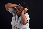 Frustrated, scream and black woman with anxiety, mental health problem and lose control on a black studio background. Emotion, screaming and model with depression, shouting and pain with burnout