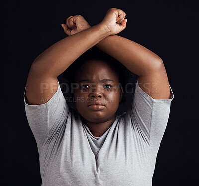 Buy stock photo Portrait, human rights and a black woman in protest of domestic violence on a dark background. Freedom, equality or empowerment with a serious young female person in studio for gender discrimination 