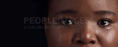 Buy stock photo Black woman, eyes and mental health, crying with depression and crisis with abuse on dark background. Sad, portrait and anxiety, depressed female person with face on banner and grief in studio