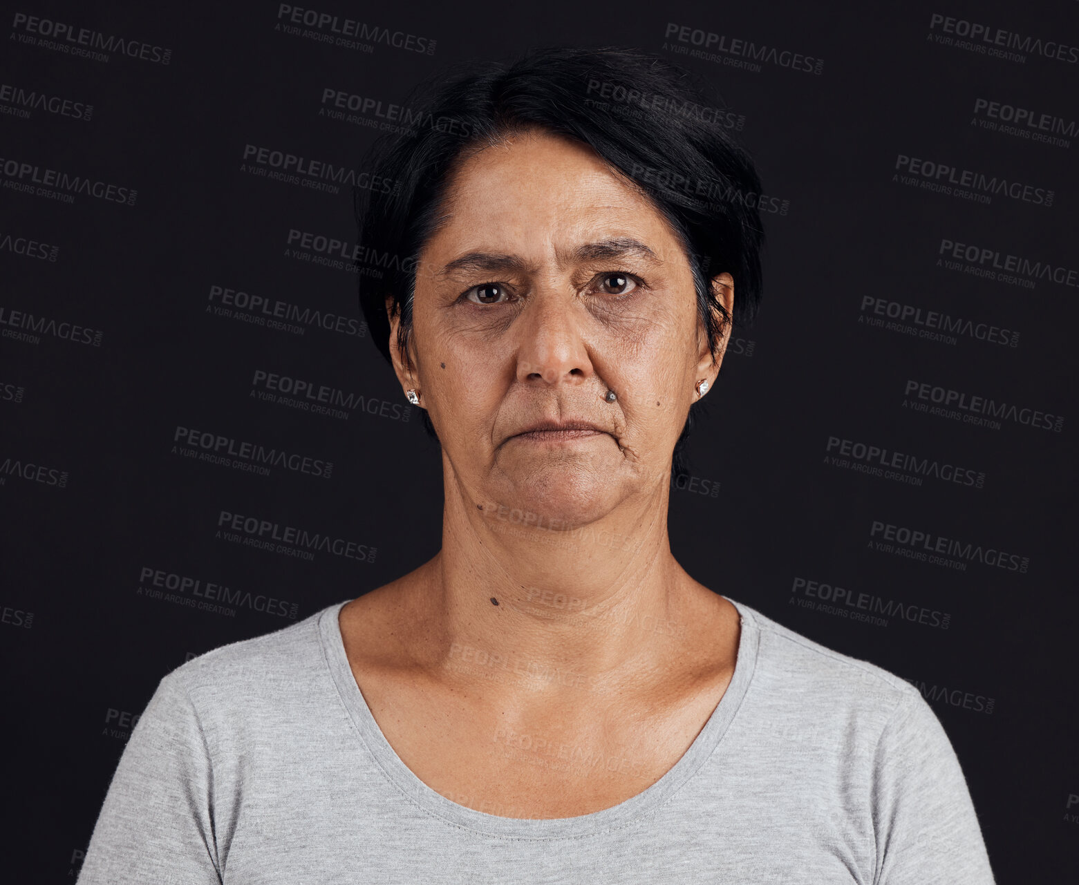 Buy stock photo Senior woman, portrait and mental health, depression and crisis with abuse isolated on black background. Sad, angry and anxiety with depressed female person, serious face and grief in a studio