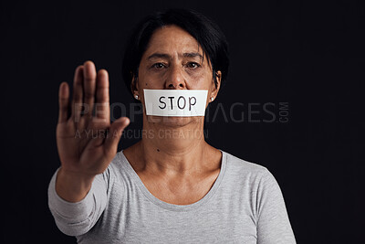 Buy stock photo Portrait, stop and palm with a woman in studio on a black background for gender equality or domestic violence. Hand, silence or abuse and a scared female victim with her mouth covered in fear