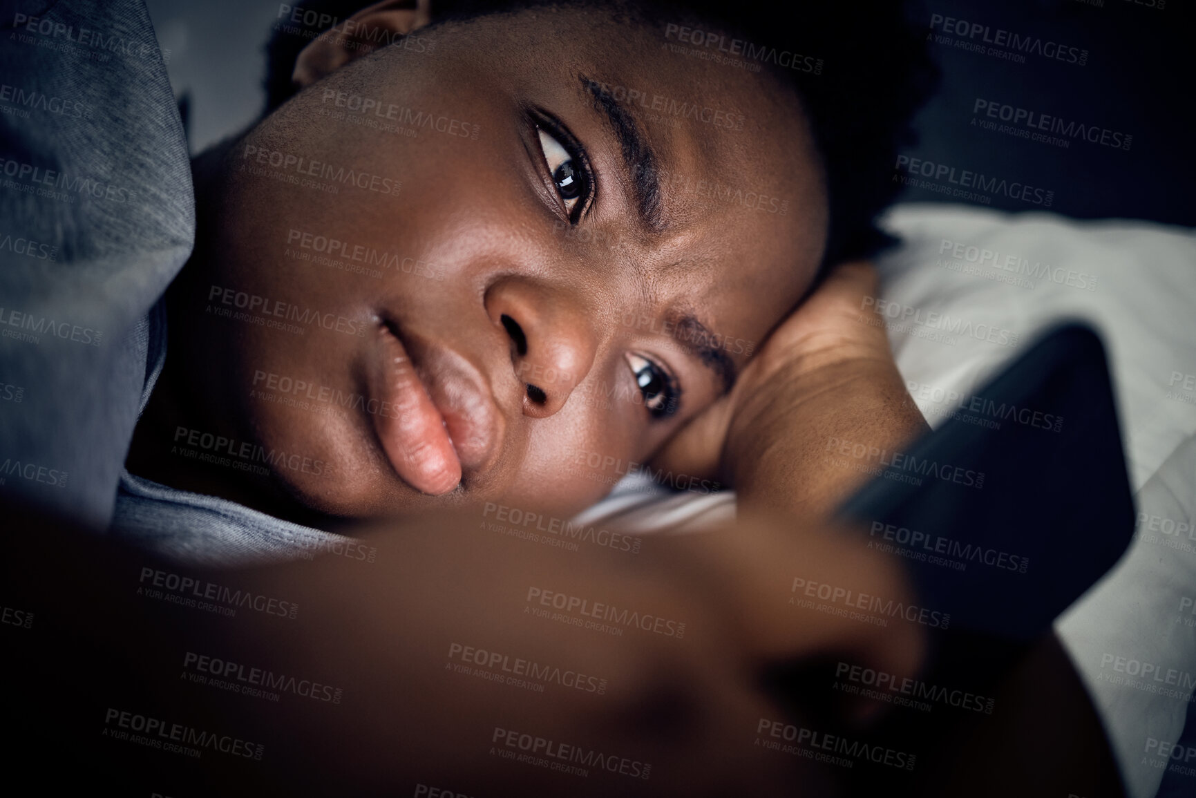 Buy stock photo Insomnia, night and black woman in bed with phone for social media lying in room for addiction at home. Stress, lonely or sad person reading online to scroll on mobile app in bedroom with depression