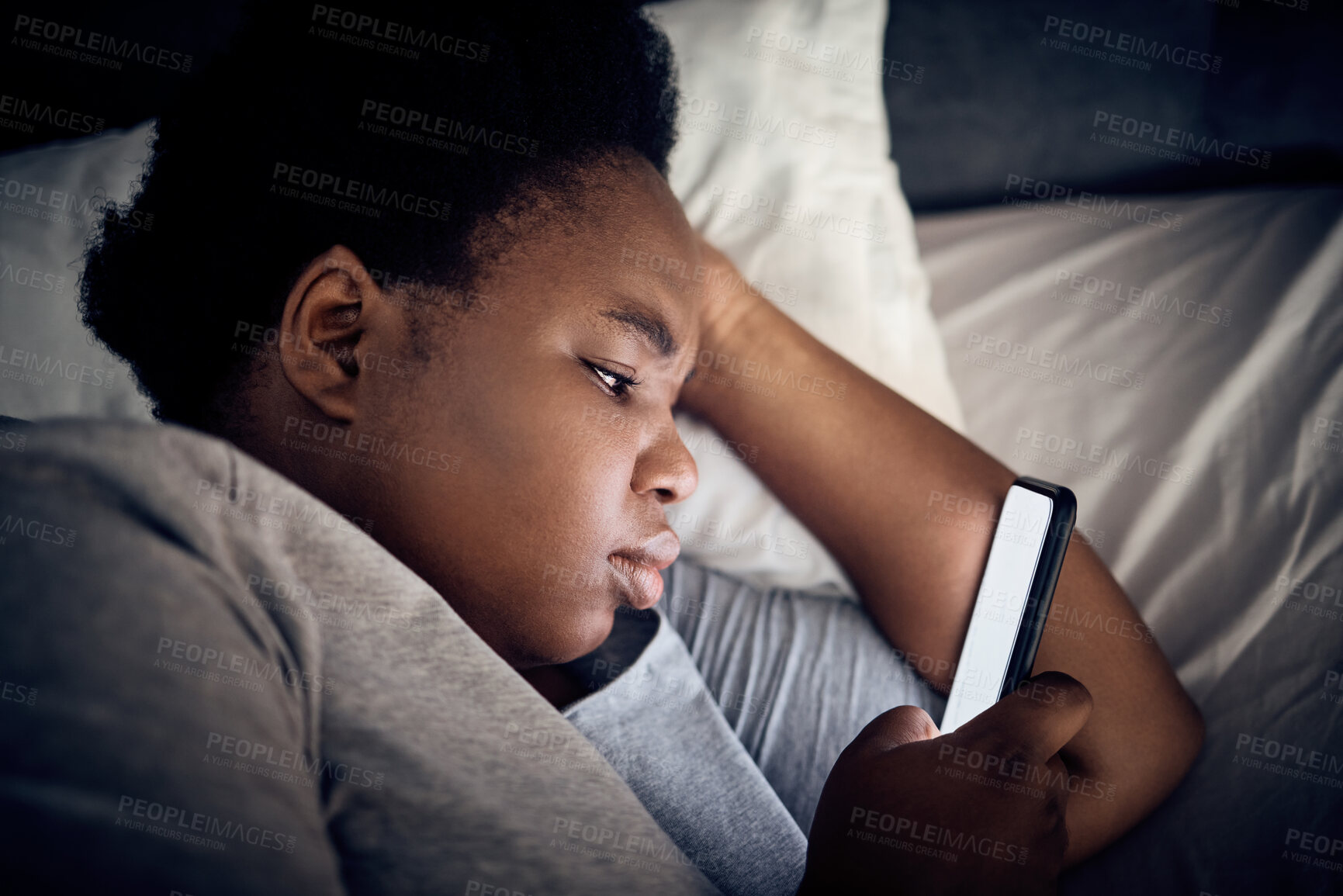 Buy stock photo Insomnia, night and black woman in bedroom with mobile for social media lying in for addiction at home. Stress, lonely or sad person reading online to scroll on phone app in bedroom with depression