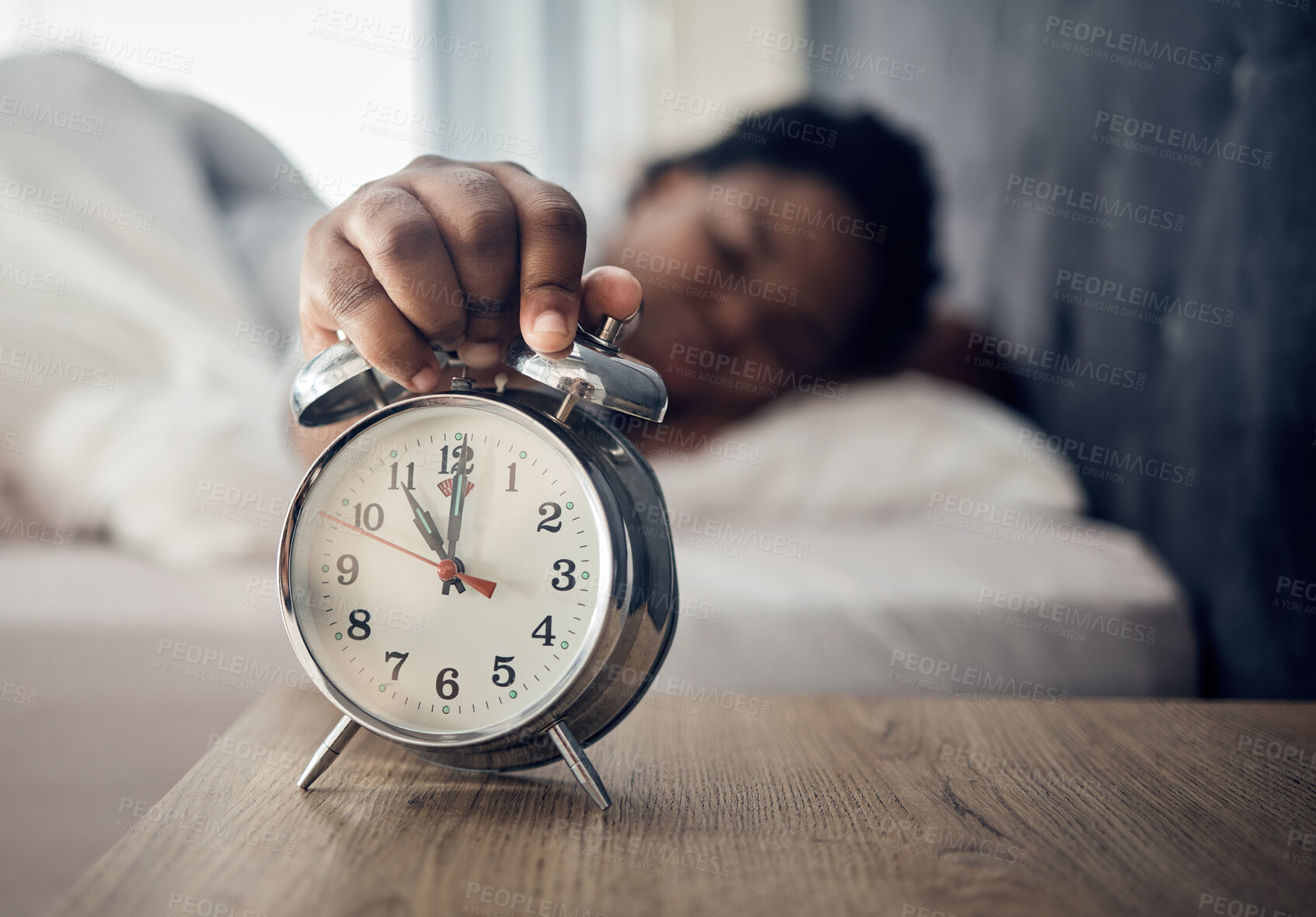 Buy stock photo Wake up, alarm clock or woman sleeping in bed in the morning after resting pressing a snooze button. Sleepy blur, hand or tired person at home getting up from nap in bedroom ready to start a new day