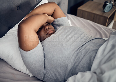 Buy stock photo Insomnia, tired and black woman in bedroom in morning with anxiety, headache and stress at home. Depression, sleep and female person with pain for mental health problem, exhausted and morning fatigue