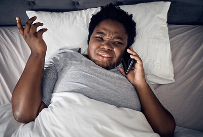 Buy stock photo Confused, above and a black woman on a phone call in bed for communication, conversation or a chat. Frustrated, home and an African girl or person speaking on a mobile in the bedroom in the morning