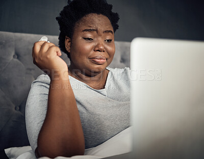 Buy stock photo Sad, crying and a black woman with a laptop in bed for a movie, film or show in a house. Depression, technology and an African person with a computer for an online drama or social media notification