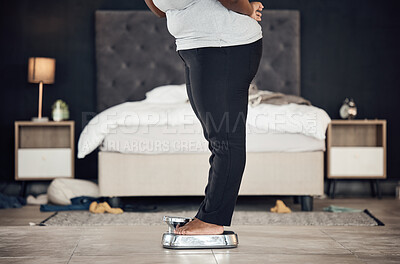 Buy stock photo Legs, scale and weightloss with a person the bedroom of their home for health, fitness or body wellness. Diet, measure and progress with a plus size adult weighing to track the results of a workout