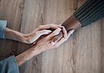 Holding hands, support and counselling, help and trust with people, top view with psychology and people pray together. Kindness, respect and worship, therapy and wellness with communication and care