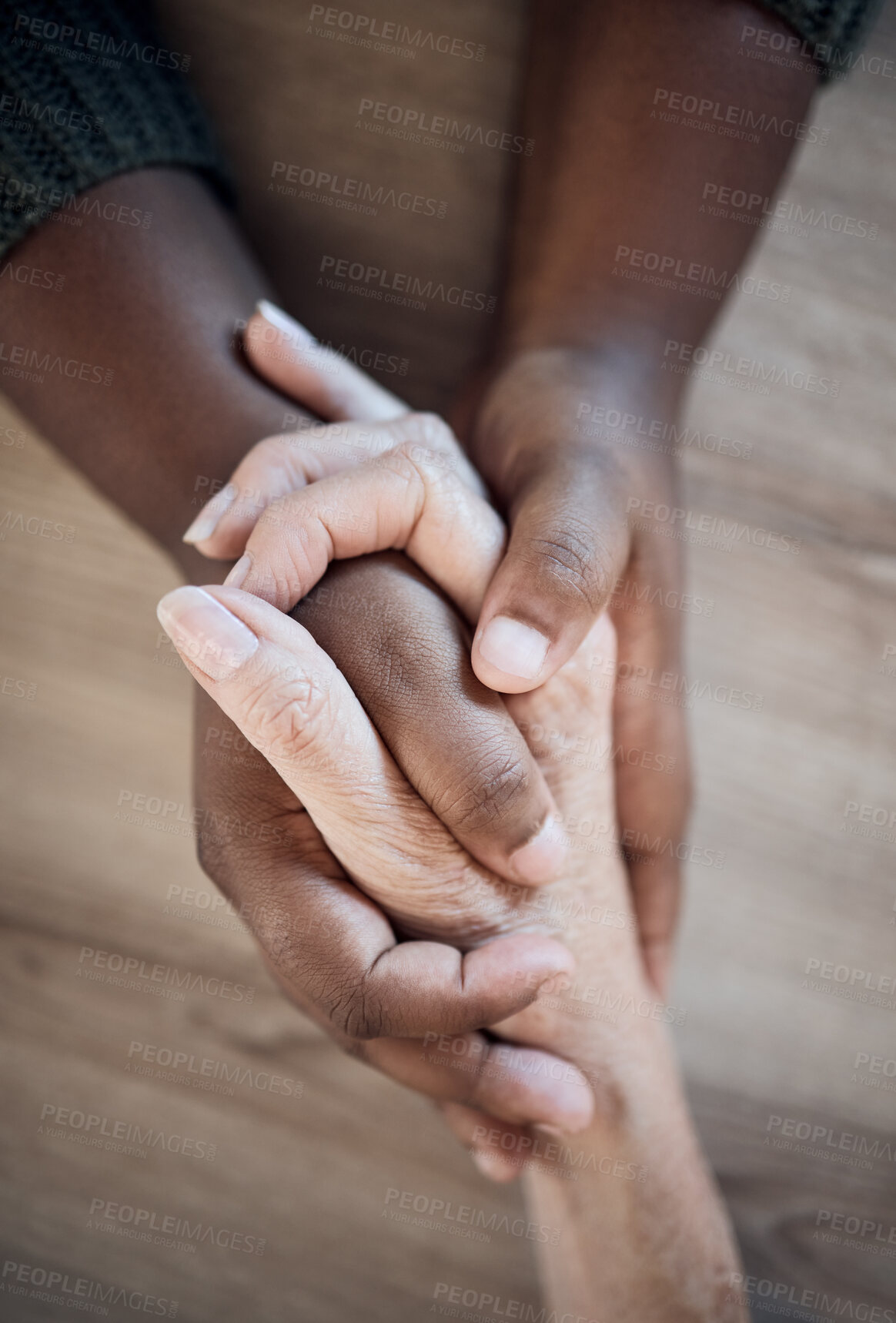 Buy stock photo Holding hands, support closeup and help, trust with people and counseling, top view with psychology and pray together. Kindness, respect and worship, therapy and wellness with communication and care