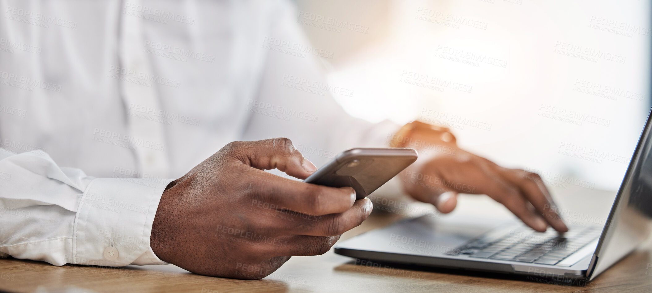 Buy stock photo Hands, business and man with a smartphone, laptop and typing to update software, network and connection. Hand of man, employee or consultant with a pc, cellphone and search internet with app analysis