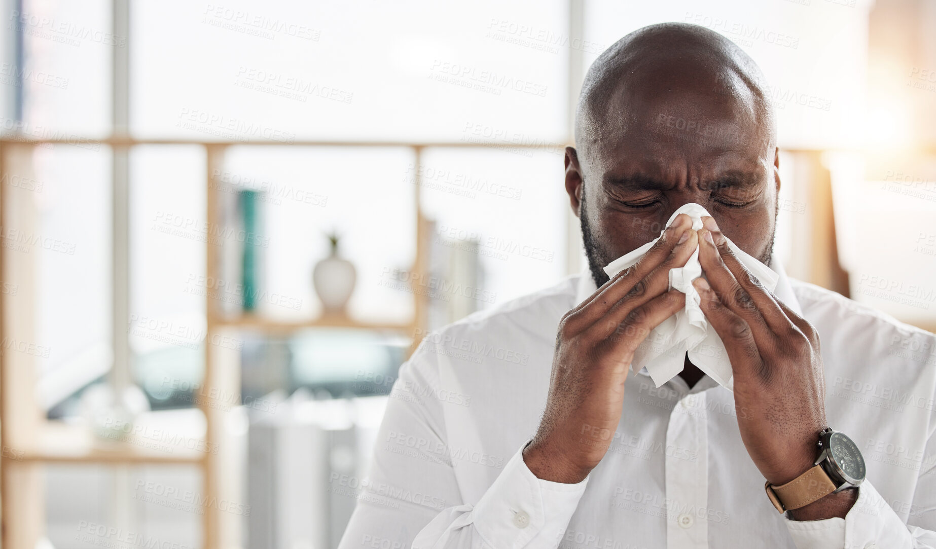 Buy stock photo Sick, tissue and businessman blowing his nose in the office with cold, flu or sinus allergies. Illness, medical and professional young African male person with hayfever while working in the workplace