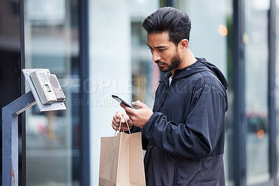 Buy stock photo Courier man, paper bag and street with phone, typing and delivery app for service in supply chain job. Young logistics worker, package and thinking with smartphone, product or e commerce in metro cbd