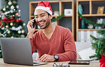 Phone call, christmas hat and businessman in the office with a laptop on cellphone for communication. Happy, smile and male creative employee with xmas decorations on mobile conversation in workplace