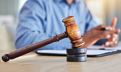 Buy stock photo Closeup, lawyer and gavel of judge in office of trial, attention and meeting for justice in courtroom, law firm or table. Hammer, legal tool or attorney working at desk for consulting of constitution