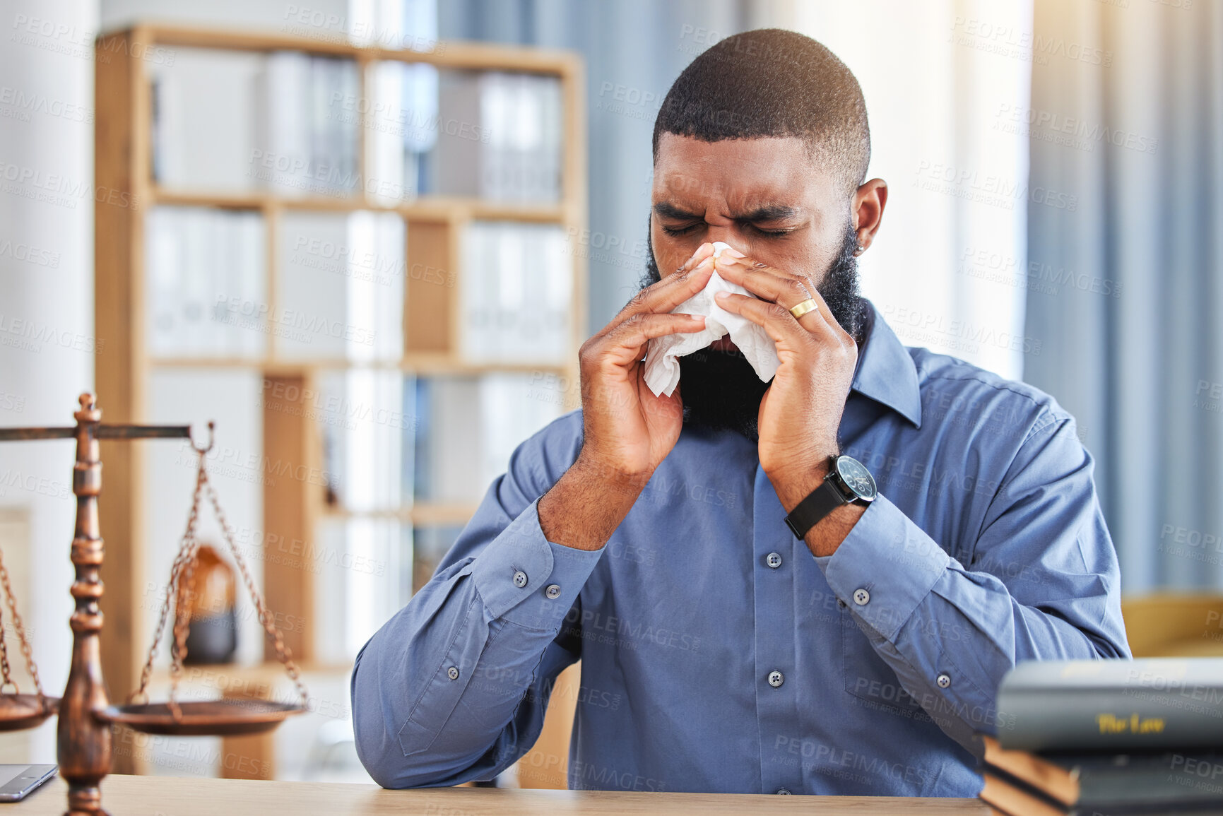 Buy stock photo Lawyer, sick and business with black man and blowing nose in office for allergy, illness and fatigue. Advocate, attorney and sneeze with male employee and tissue for virus, infection and hayfever