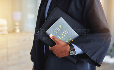 Buy stock photo Law, book and hands of a judge with knowledge on the rules or research of legal constitution, regulation or policy from government. Black man, lawyer or expert attorney of court justice and judgment