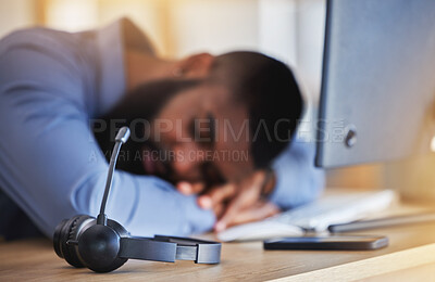 Buy stock photo Call center, tired and man sleeping with microphone at desk for burnout, fatigue and low energy in telemarketing office. Closeup, stress and business consultant taking a nap at table in sales agency