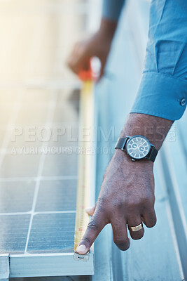 Buy stock photo Engineer, hands and tape to measure solar panel on rooftop for sustainable planning, construction and building grid. Closeup of technician, electrician and man with measurement of photovoltaic system
