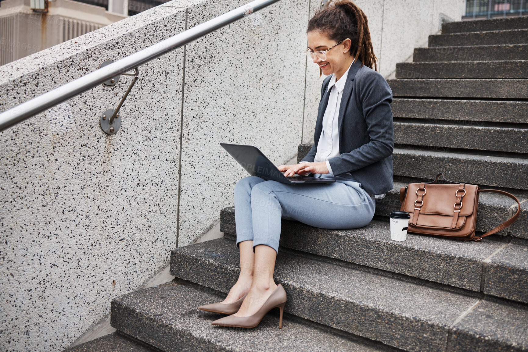 Buy stock photo Business woman, stairs and typing on laptop, planning schedule and thinking with ideas, copywriting or city. Young entrepreneur, smile and sitting on steps with computer for remote work in metro cbd