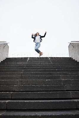 Buy stock photo Business person, stairs and jump for celebration, success and goals in finance career, investment and stock market. Young woman, winner and fist in air for achievement, pride or lottery on city steps