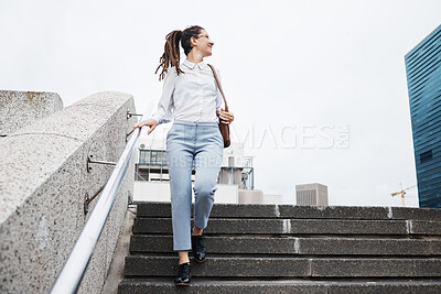 Buy stock photo Business, woman and walking on city building steps happy, smile and looking while traveling. Travel, walk and female person smile for commute, thinking and enjoying solo trip in New York outdoor