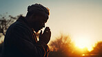 Black man, praying and hands at sunrise for religion, faith and spiritual worship for Catholic God. Ai generated, person and African Christian with prayer hands for hope, Christian and thank you