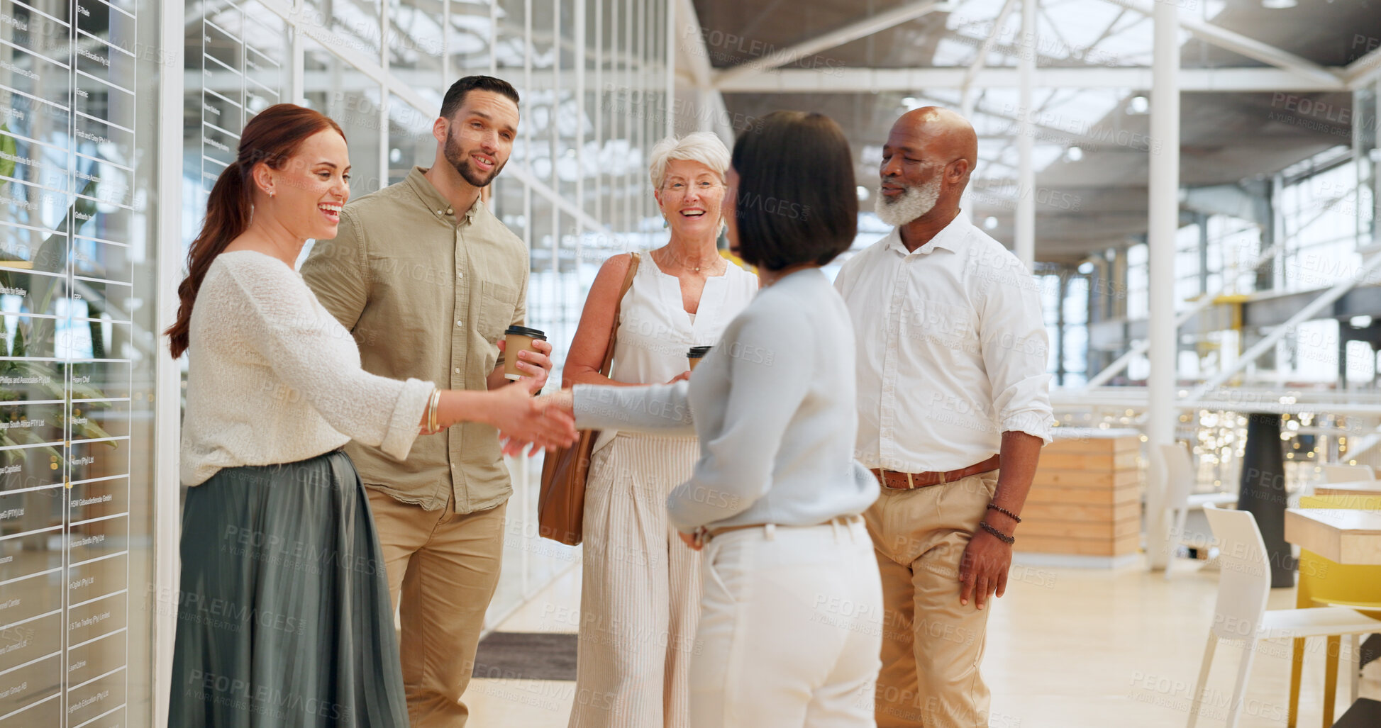 Buy stock photo Handshake, meeting and business people in office building lobby at corporate, convention, global company for networking. Diversity employees shaking hands for hello, welcome and b2b team introduction