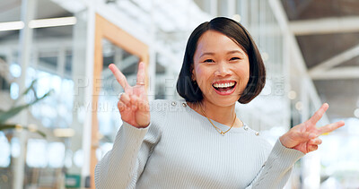 Peace sign, happy asian woman and face of success, motivation or pride in trendy office building in China. Portrait, excited female and v sign, hand emoji and celebration for happiness, winner or joy