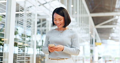Woman, phone and walking while online for communication, chat or notification at a shopping mall after work while using mobile app for banking. Female on smartphone to with wifi for social network