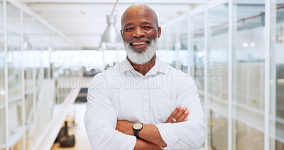 Motivation, mindset and mission with a business black man standing arms crossed in his office at work. Portrait, happy and smile with a senior male manager or employee working with company vision