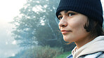 Face, thinking and a happy woman outdoor in nature to relax and breath fresh air to relax. Vacation, calm woods and closeup of a young african girl on a holiday or hike on misty morning with a smile