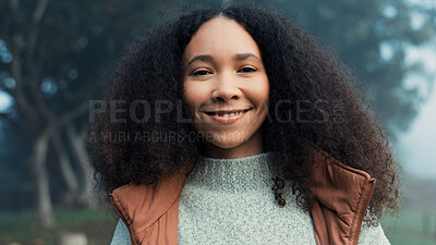 Portrait, face and a happy woman outdoor in nature to relax and breathe fresh air. Vacation, calm woods and closeup of a young african girl on holiday or hike on misty morning with a confident smile