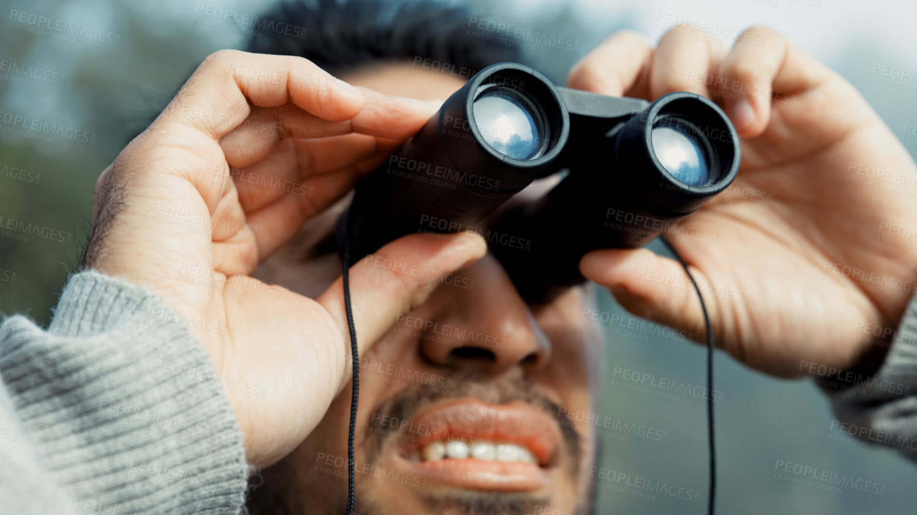 Buy stock photo Face, hiking and man with binocular in nature for sightseeing, explore or trekking a mountain environment. Travel, adventure and view with a young male hiker closeup outdoor in the woods or forest