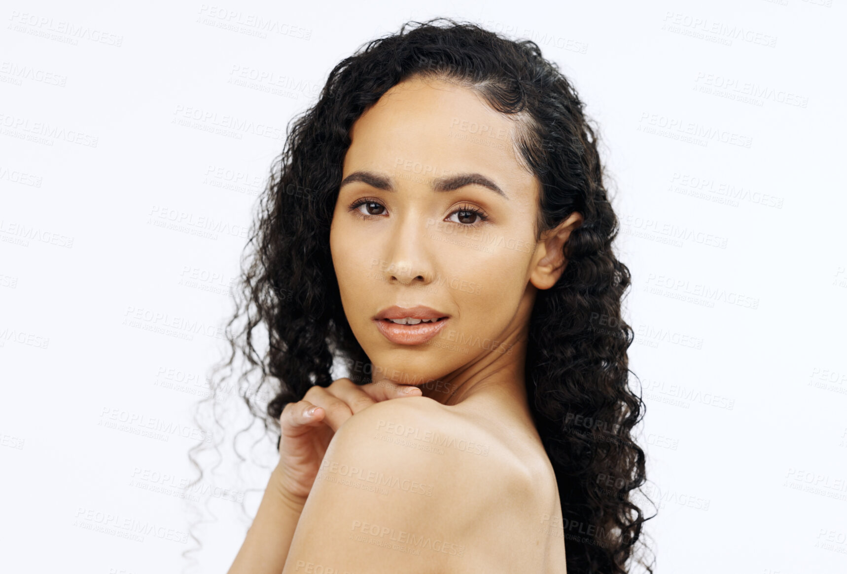 Buy stock photo Face, beauty and skin with a model black woman touching her shoulder in studio on a gray background. Portrait, skincare and sensual with an attractive young female feeling her smooth or soft body