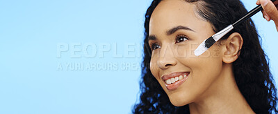 Woman, face and brush cream for beauty, aesthetic salon and skincare on mockup blue background. Happy studio model, facial lotion and makeup cosmetics for dermatology, collagen and smile of happiness