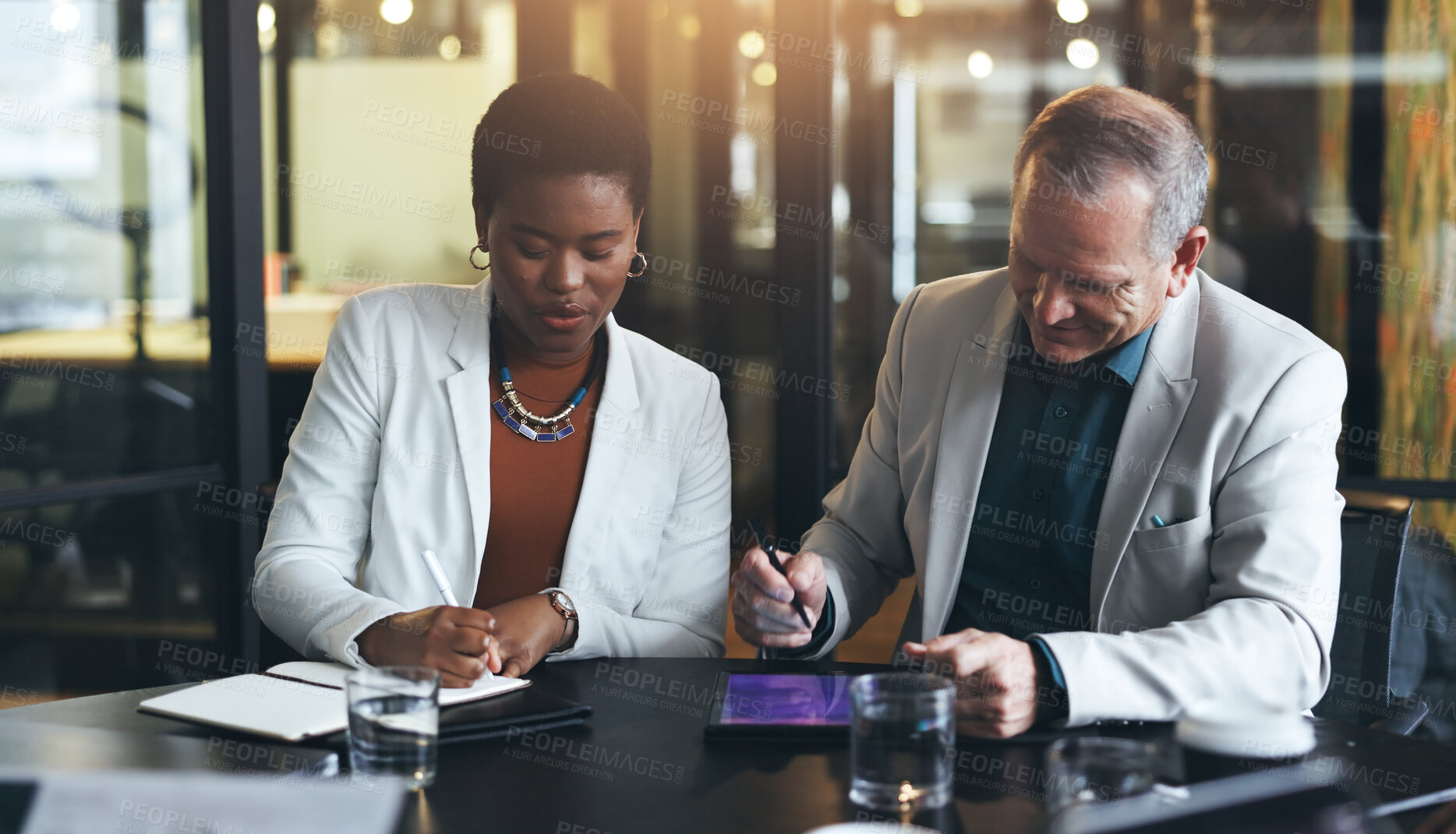 Buy stock photo Businesspeople, team and strategy with tablet in office for coaching, digital marketing or discussion. Diversity, man and woman in corporate for meeting, technology and web with notebook for feedback