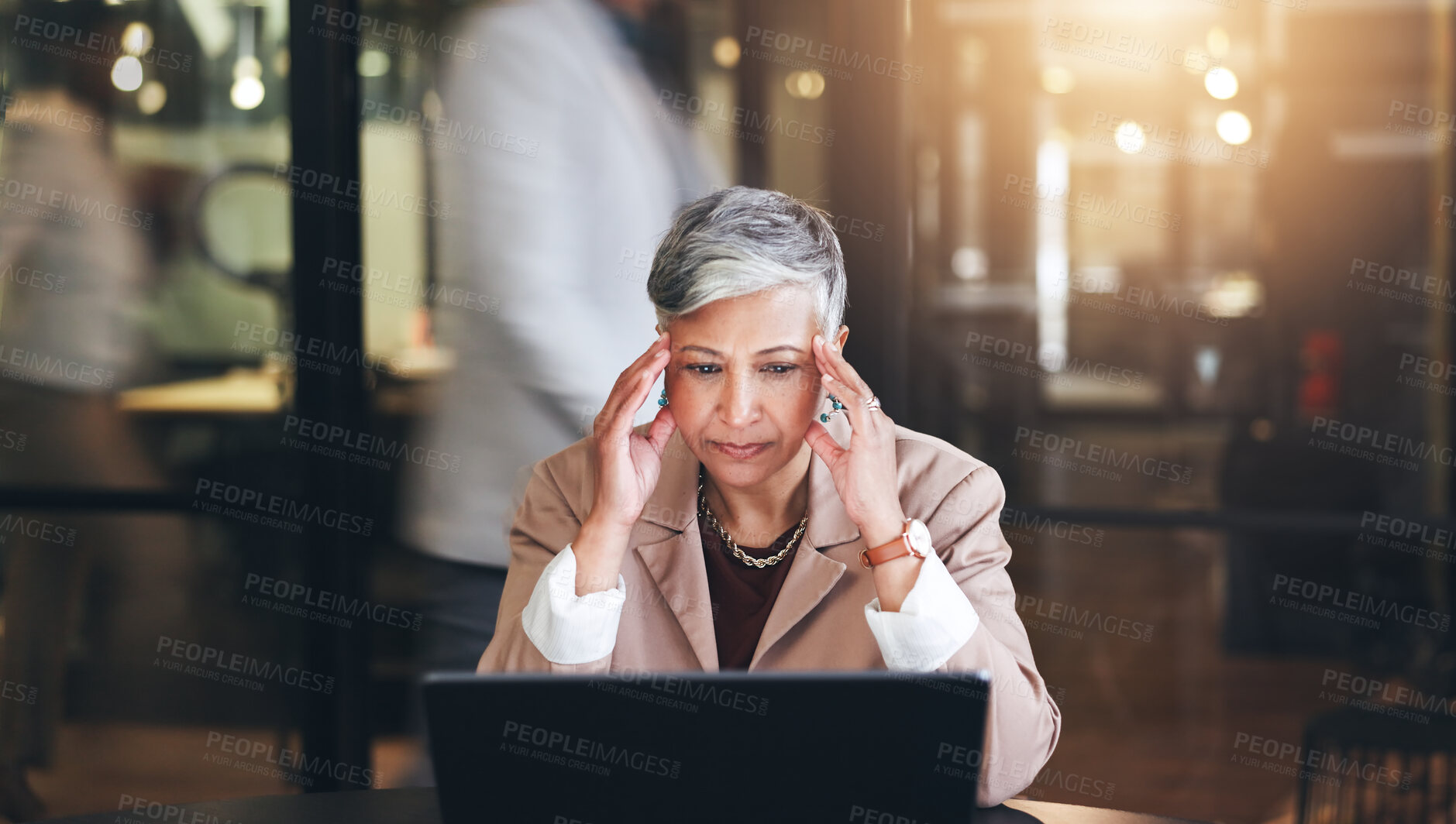 Buy stock photo Senior woman, stress and headache in business pressure, burnout or fatigue at busy office. Face of mature female person or employee with migraine, mental health or thinking on laptop at workplace