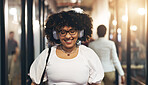 Headphones, happy and face of a woman in the office walking with her colleagues to her desk. Greeting, smile and portrait of a female creative designer listening to music, radio or song in workplace.